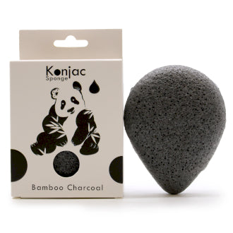 Bamboo charcoal bathroom accessories - konjac bamboo charcoal black sponges,  bamboo charcoal stick and handmade black charcoal soap on earth toned sto  Stock Photo - Alamy